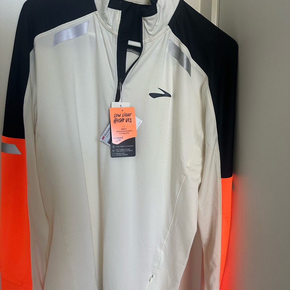 Brooks high visibility White Jacket with Black and Orange Details
